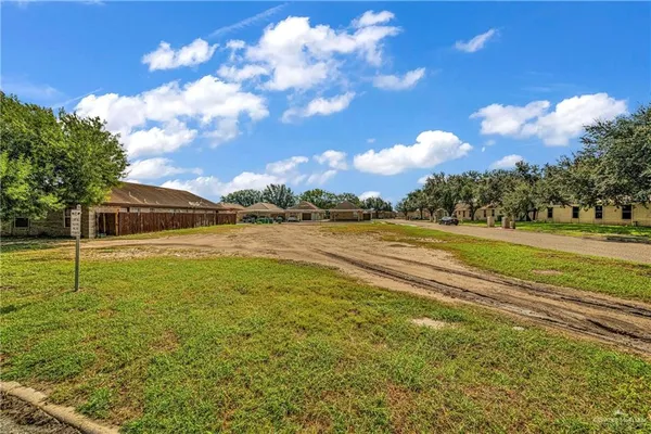 a view of a swimming pool with an outdoor seating and a garden