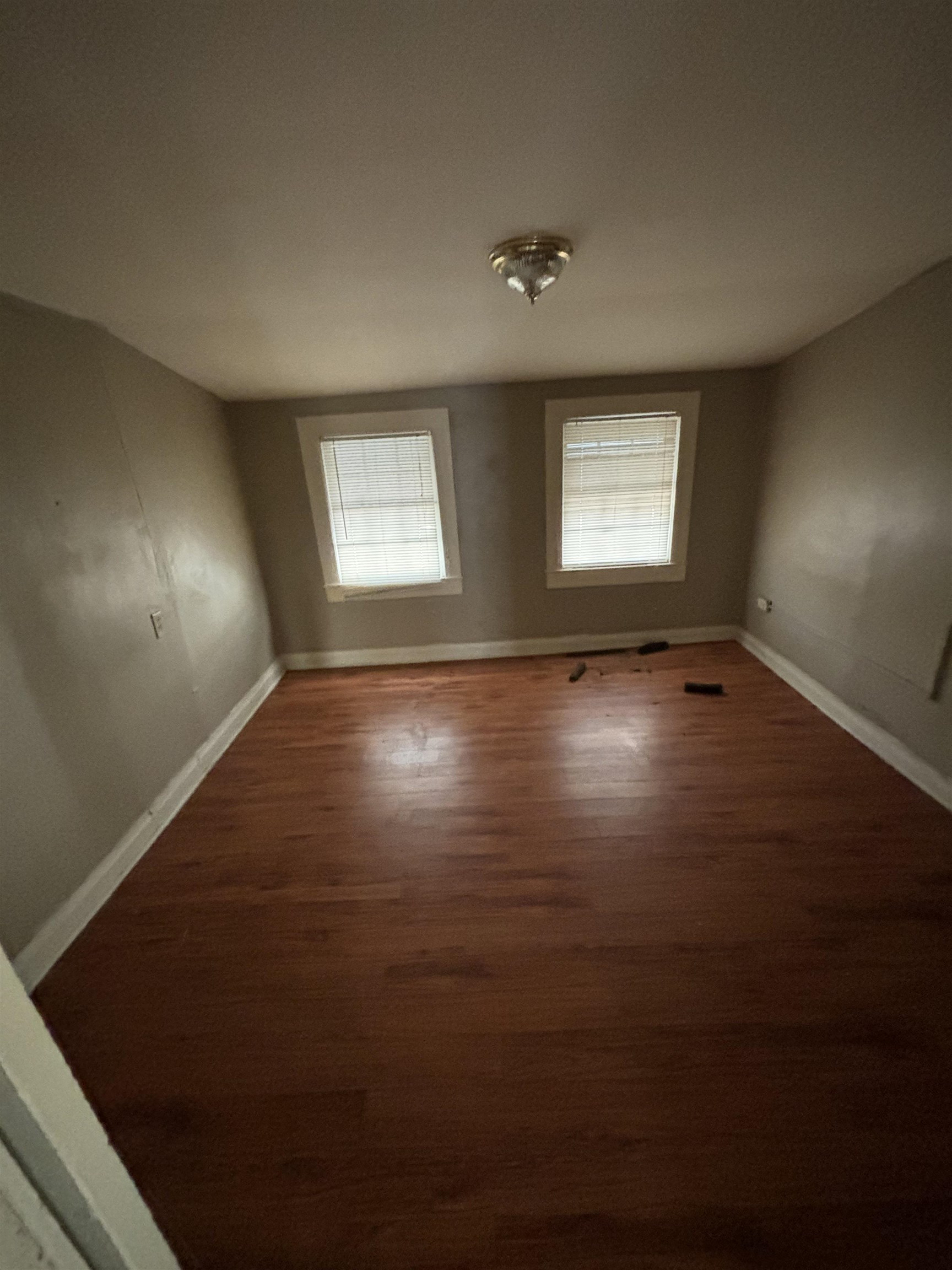 1920 Oliver Avenue Memphis, TN 38104 - Photo 11 of 19 Spare room with baseboards and wood finished floors