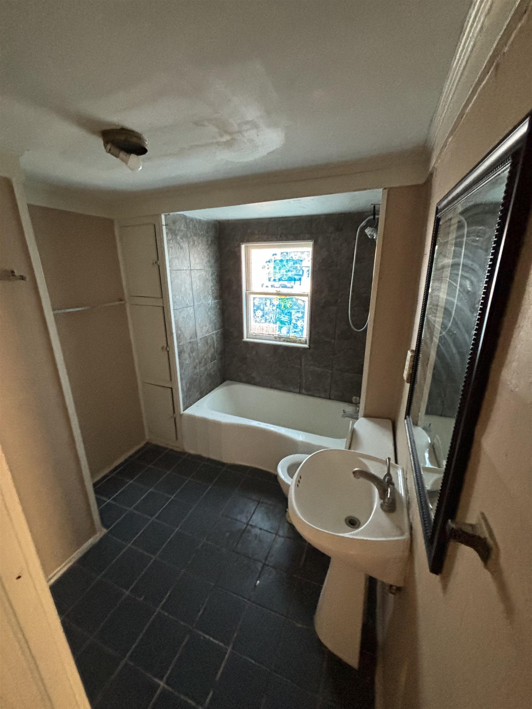1920 Oliver Avenue Memphis, TN 38104 - Photo 13 of 19 Bathroom with bathing tub / shower combination and a sink