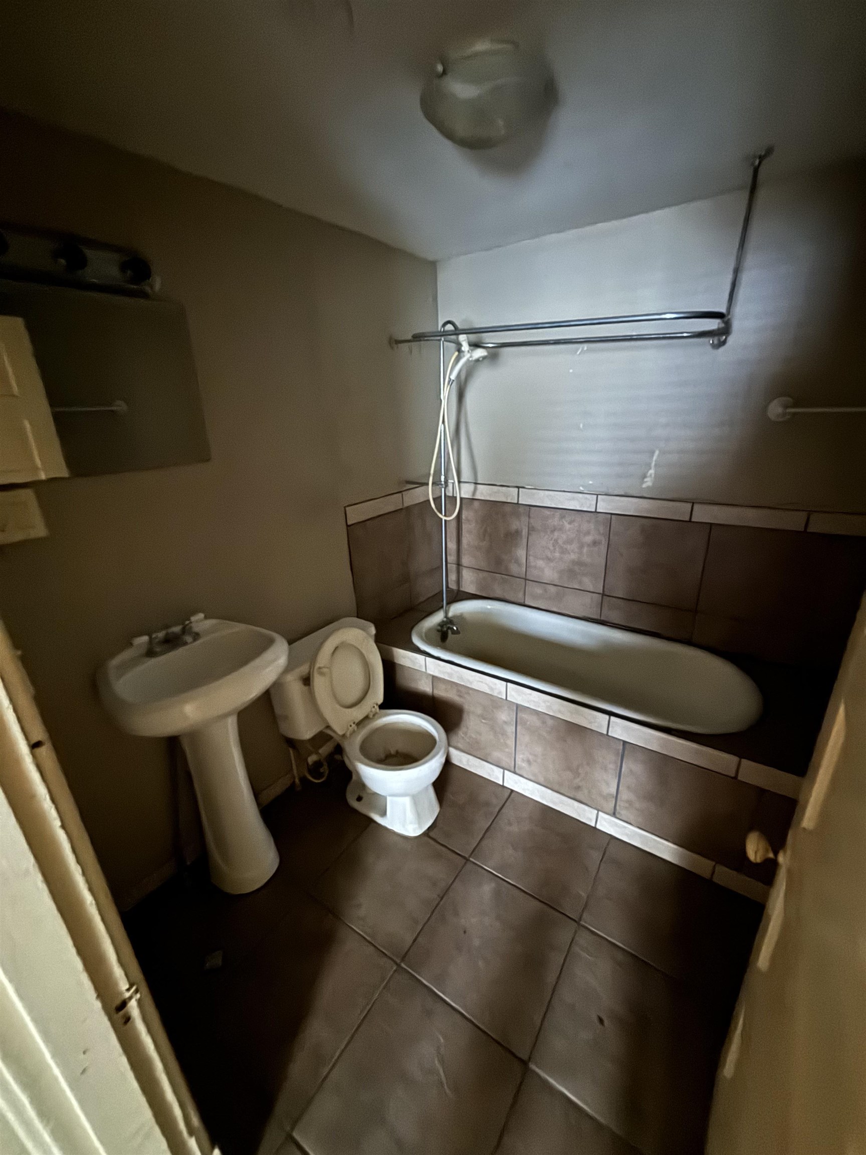 1920 Oliver Avenue Memphis, TN 38104 - Photo 17 of 19 Bathroom with toilet, tile patterned flooring, and tiled shower / bath