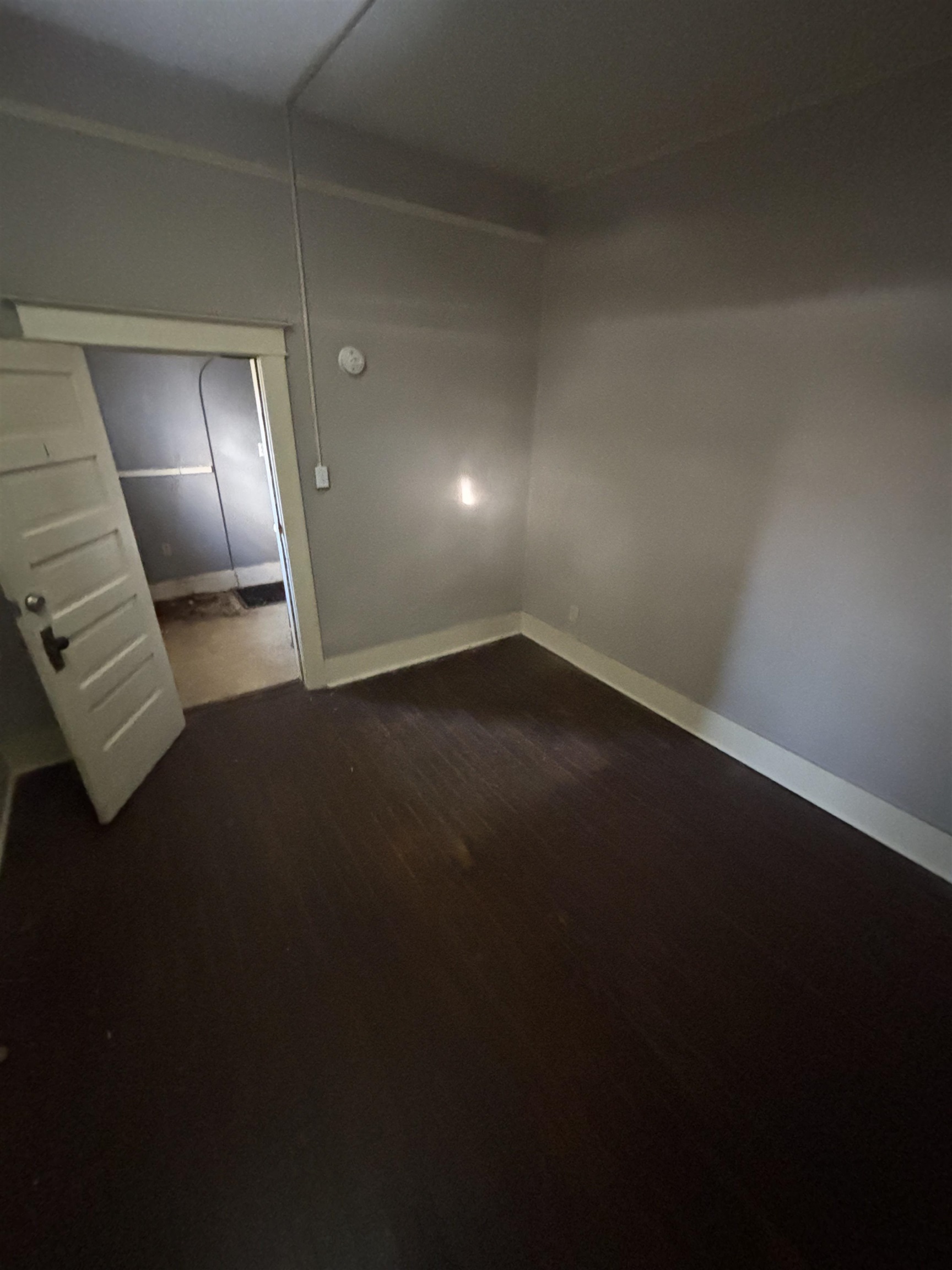 1920 Oliver Avenue Memphis, TN 38104 - Photo 5 of 19 Spare room with dark wood-style floors and baseboards