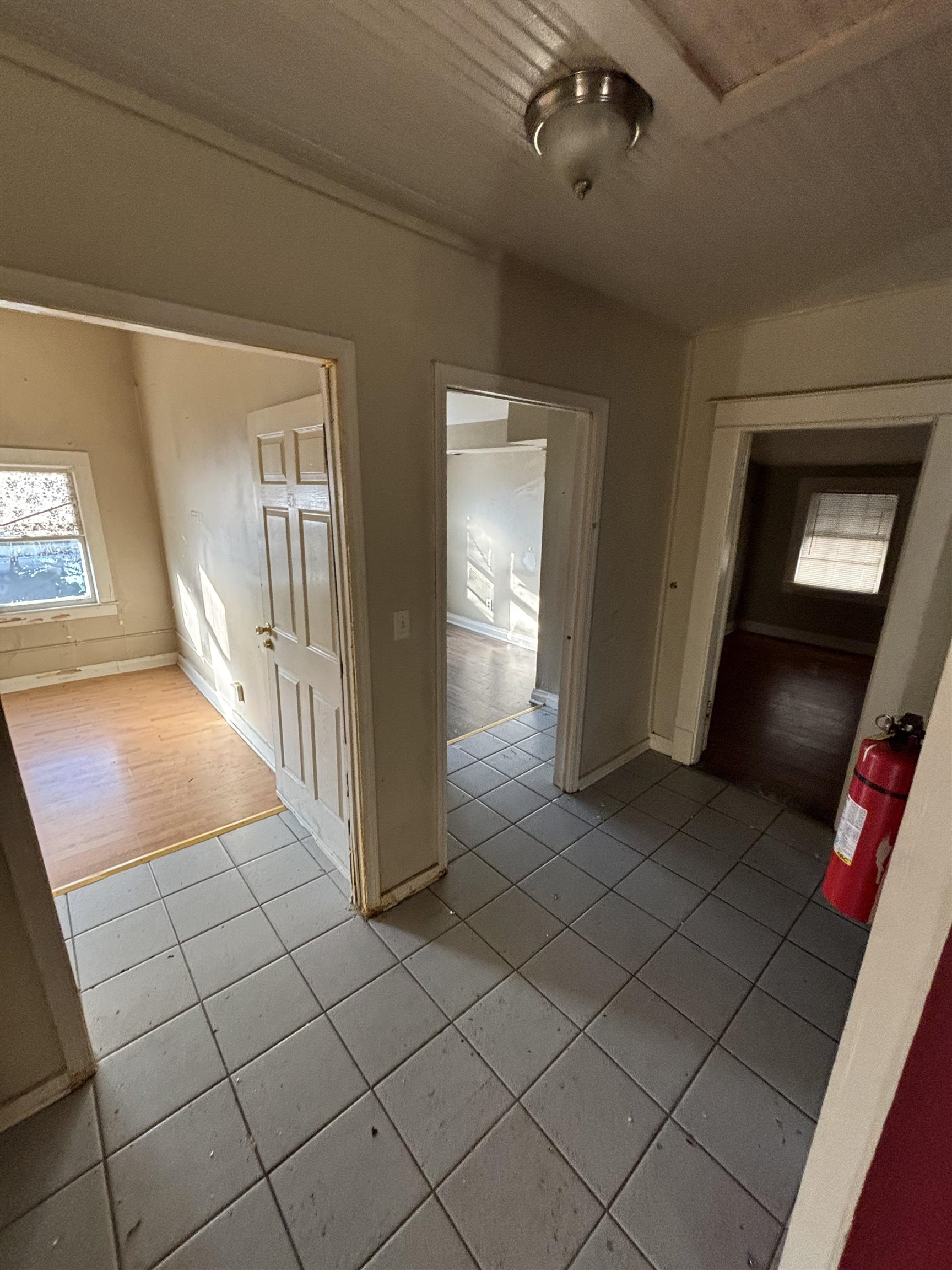 1920 Oliver Avenue Memphis, TN 38104 - Photo 7 of 19 Hallway with light tile patterned floors and baseboards
