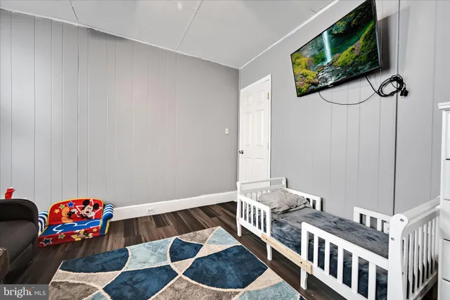 a bedroom with furniture and a chair