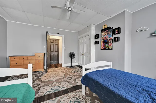 a bedroom with a bed and a table in it