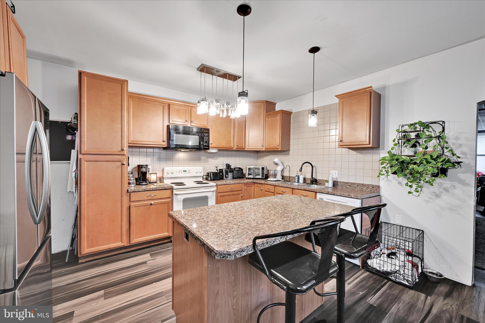 33 North 10th Street Lebanon, PA 17046 - Photo 8 of 31 a kitchen with stainless steel appliances granite countertop a stove refrigerator sink and microwave