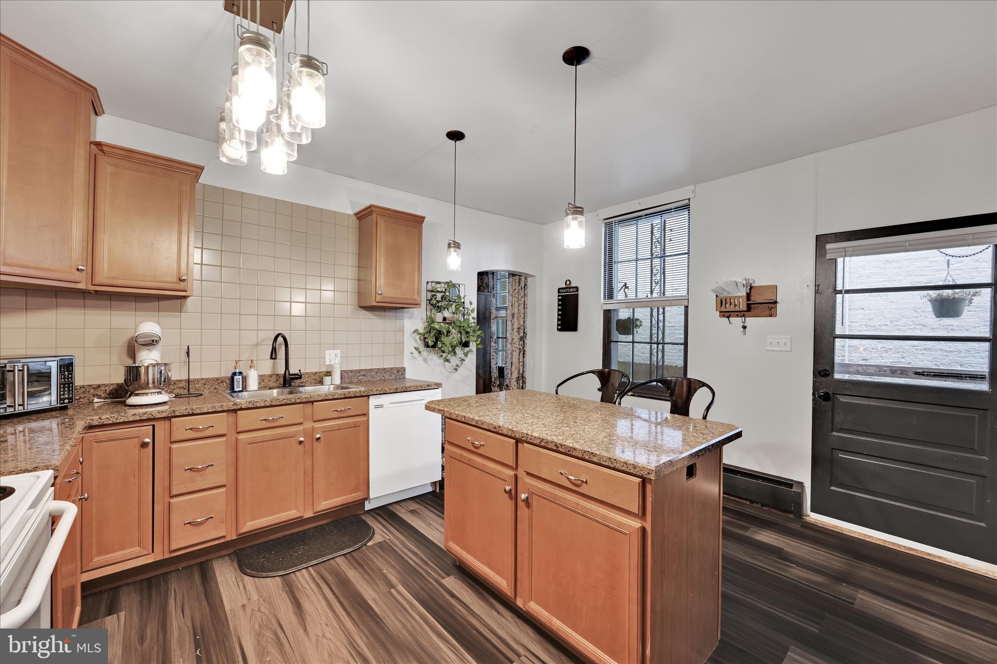 33 North 10th Street Lebanon, PA 17046 - Photo 9 of 31 a kitchen with stainless steel appliances granite countertop a sink stove and refrigerator
