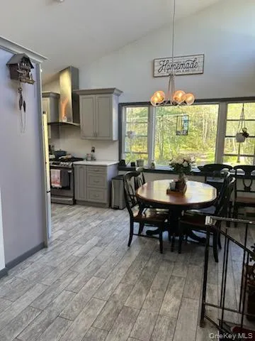 a kitchen with a table and chairs in it