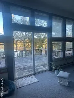 a room with furniture and a large window