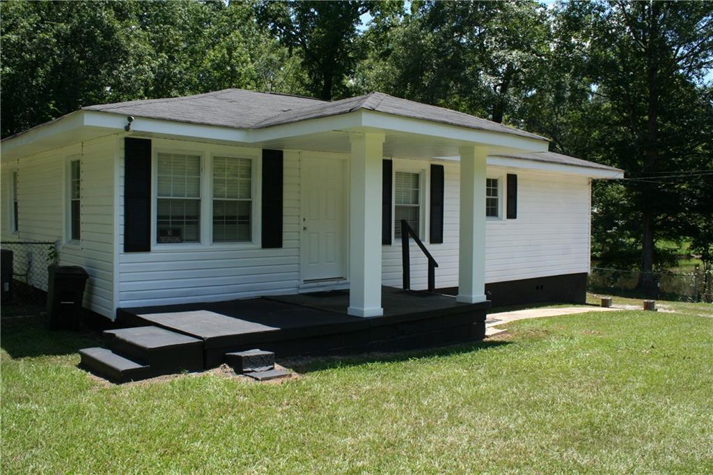 3735 South Seale Road Phenix City, AL 36869 - Photo 3 of 27 View of Front Left of home featuring covered porch, a front lawn, and a shingled roof