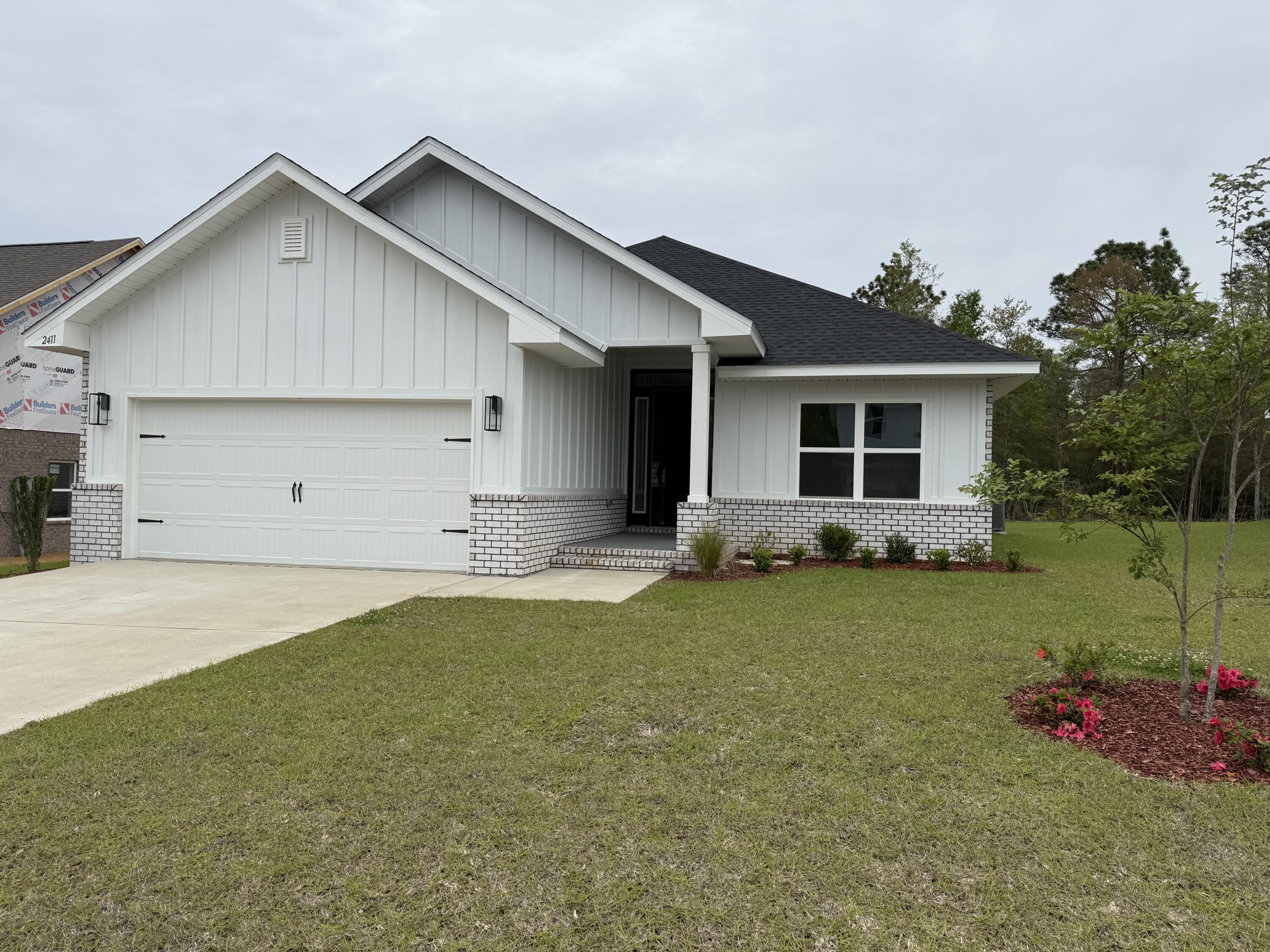 2411 Aleia Lane Crestview, FL 32536 - Photo 1 of 28 a front view of house with yard and trees