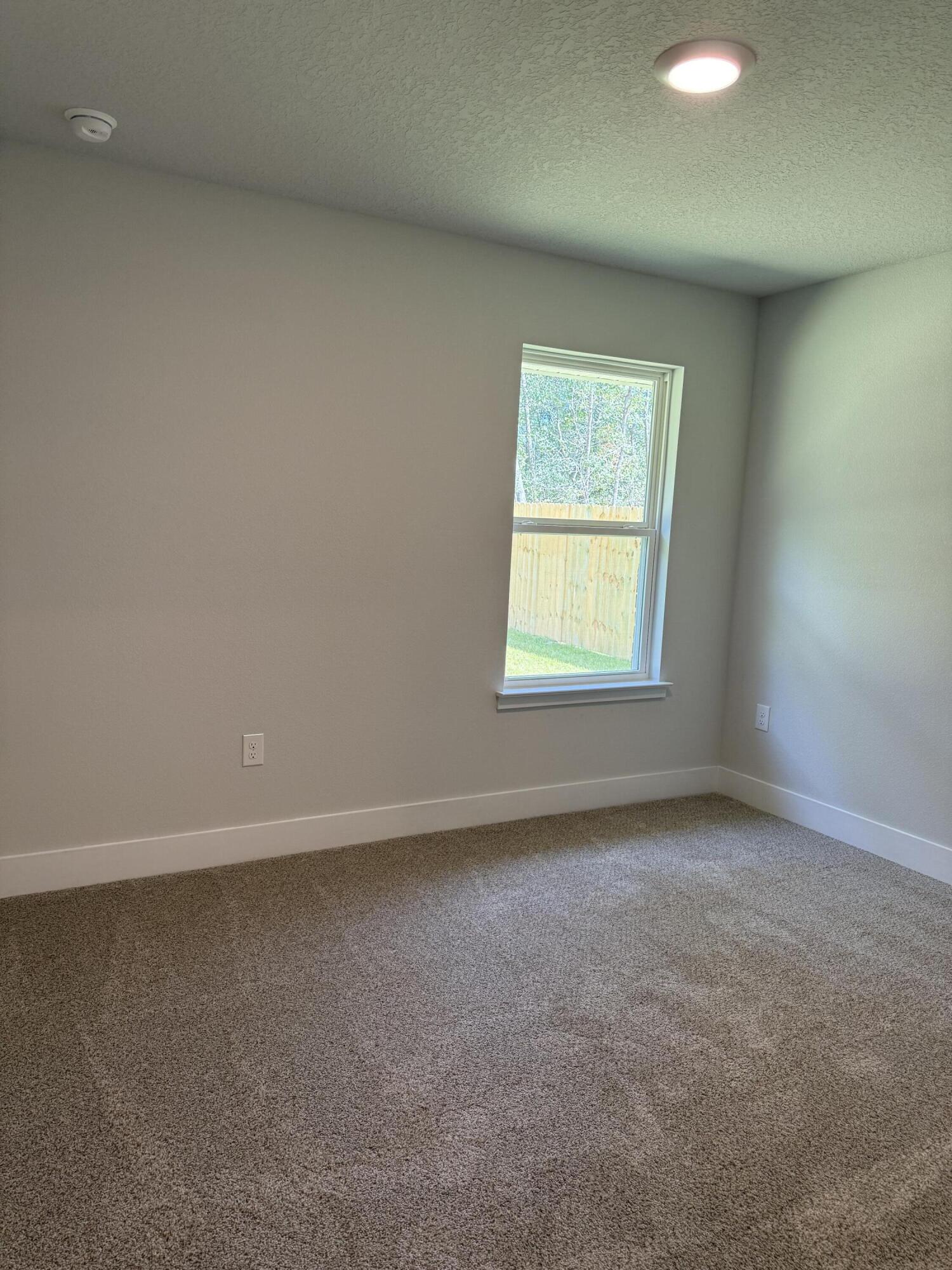 2411 Aleia Lane Crestview, FL 32536 - Photo 14 of 21 an empty room with a window