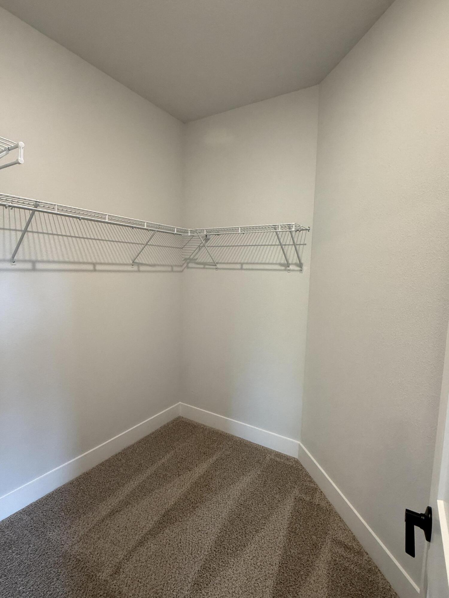 2411 Aleia Lane Crestview, FL 32536 - Photo 16 of 28 a view of a room with racks on the wall