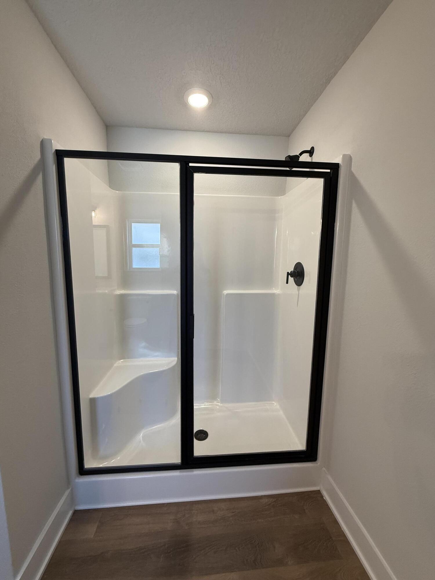 2411 Aleia Lane Crestview, FL 32536 - Photo 19 of 21 a bathroom with a glass shower door