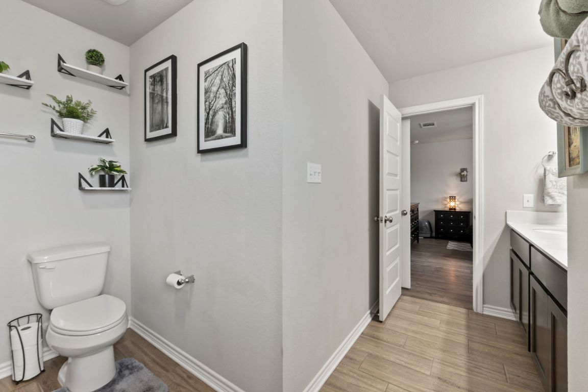 232 Syrah Court Leander, TX 78641 - Photo 17 of 37 a bathroom with a toilet and a sink