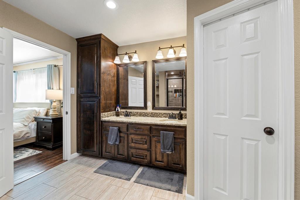 134 Thiele Road Lorena, TX 76655 - Photo 17 of 37 a bathroom with a glass door shower and a sink