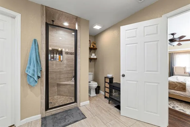 a bathroom with a shower and a sink