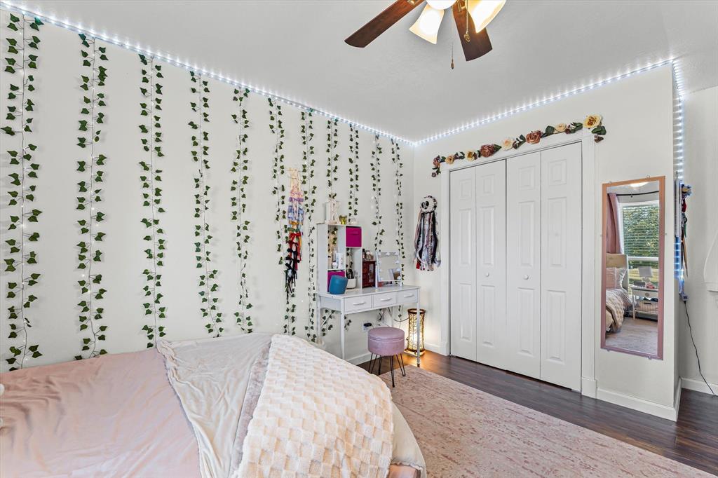 134 Thiele Road Lorena, TX 76655 - Photo 20 of 37 a bedroom with a bed and a chandelier