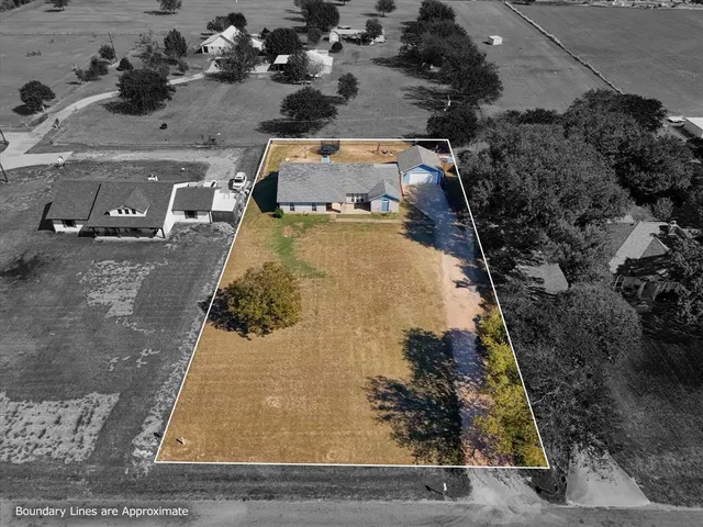 a aerial view of residential houses with outdoor space