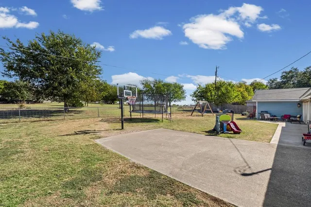 a view of a swimming pool with a patio