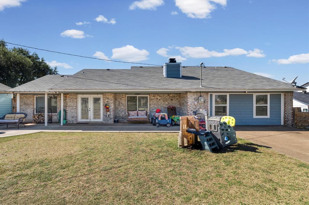 134 Thiele Road Lorena, TX 76655 - Photo 33 of 37 a front view of a house with swimming pool and chairs