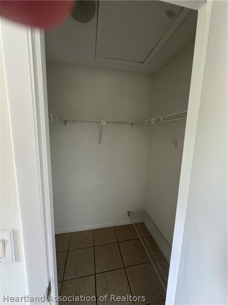 237 Rhapsody Avenue Lake Placid, FL 33852 - Photo 13 of 18 a view of a room with wooden floor