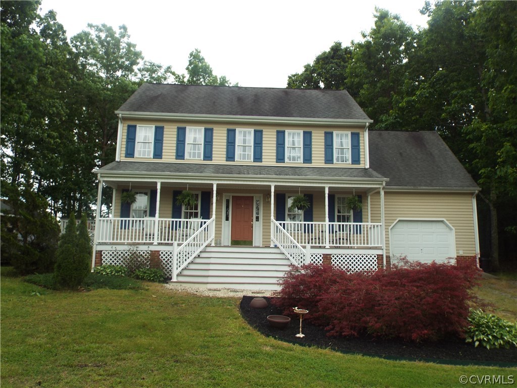 6303 Trinity Church Road Church Road, VA 23833 - Photo 3 of 46 a front view of a house with a garden
