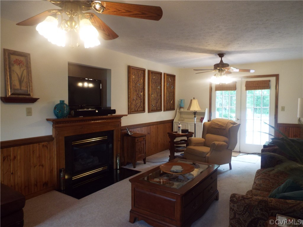 6303 Trinity Church Road Church Road, VA 23833 - Photo 8 of 46 a living room with furniture a large window and a fireplace