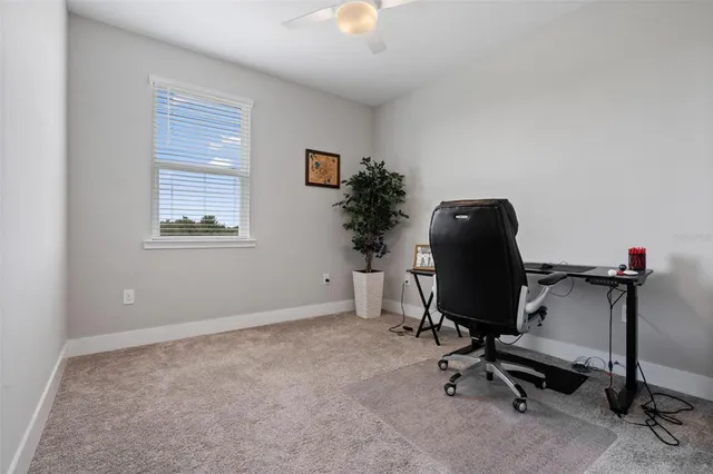 a view of a workspace with furniture