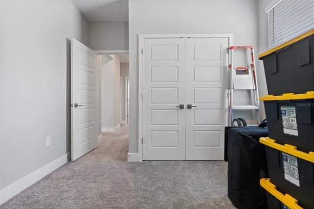 a bathroom with a toilet a sink a mirror a shower and vanity