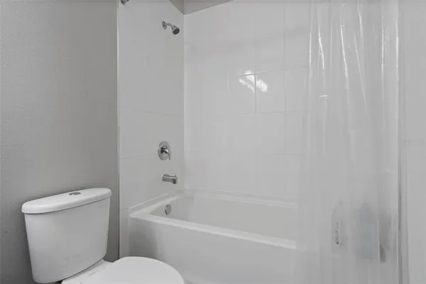 a spacious bathroom with a double vanity sink a mirror and shower