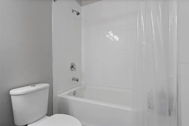 a spacious bathroom with a double vanity sink a mirror and shower