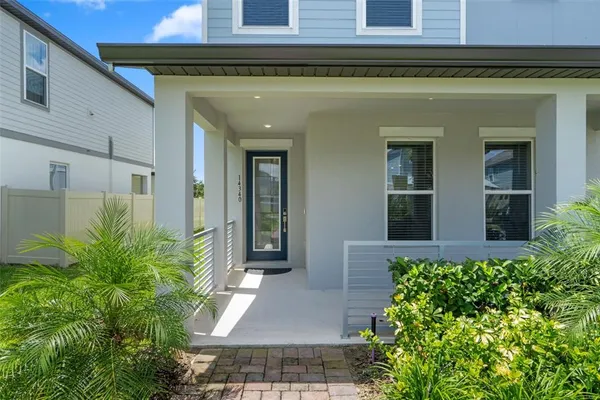 a view of a balcony with floor to ceiling windows