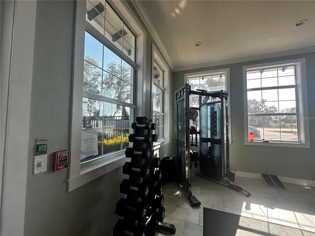 a room with lots of furniture and windows