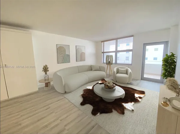 a living room with furniture and a large window