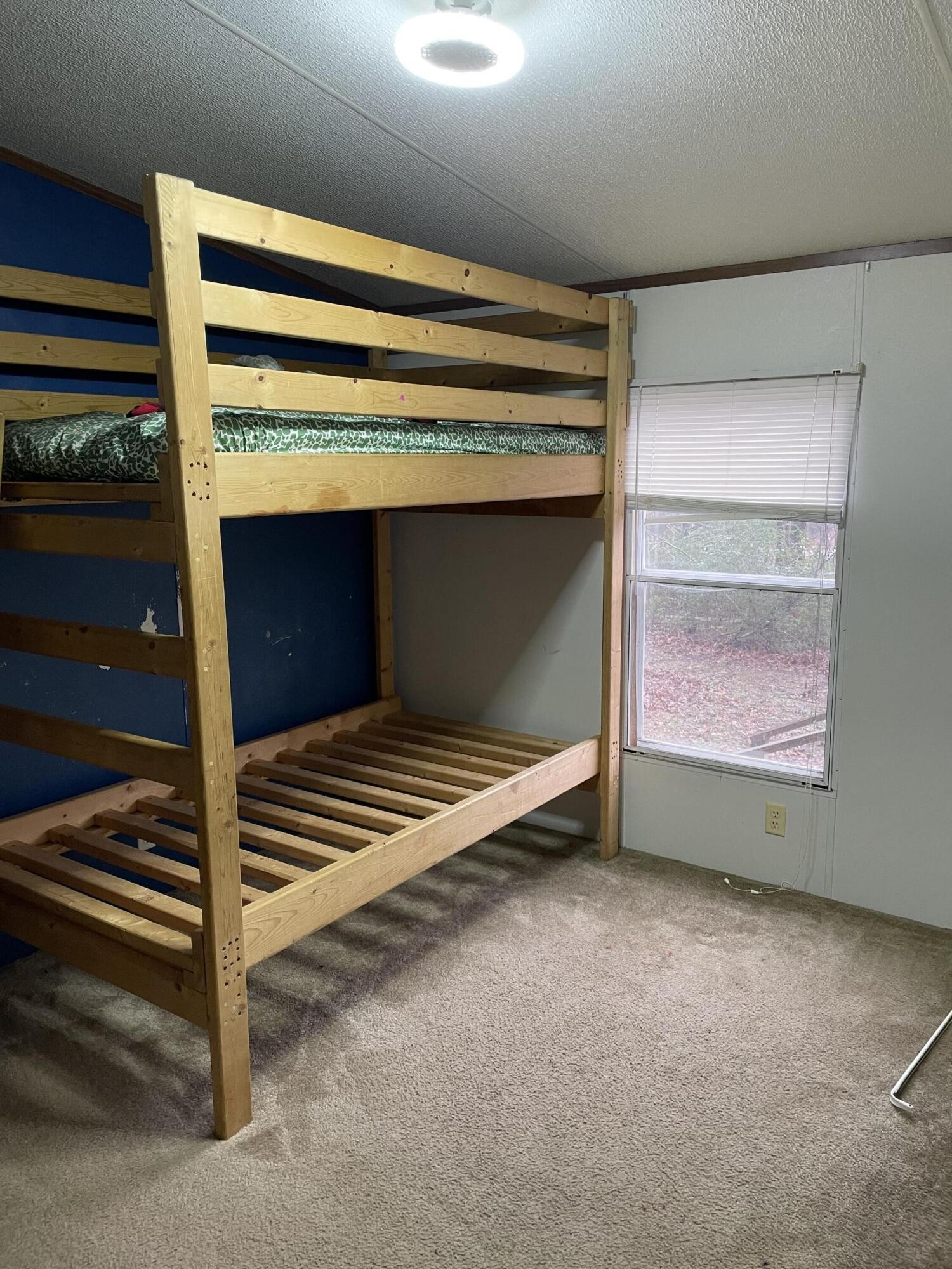 122 Haddock Lane Benton, TN 37307 - Photo 16 of 23 a view of an empty room and wooden floor