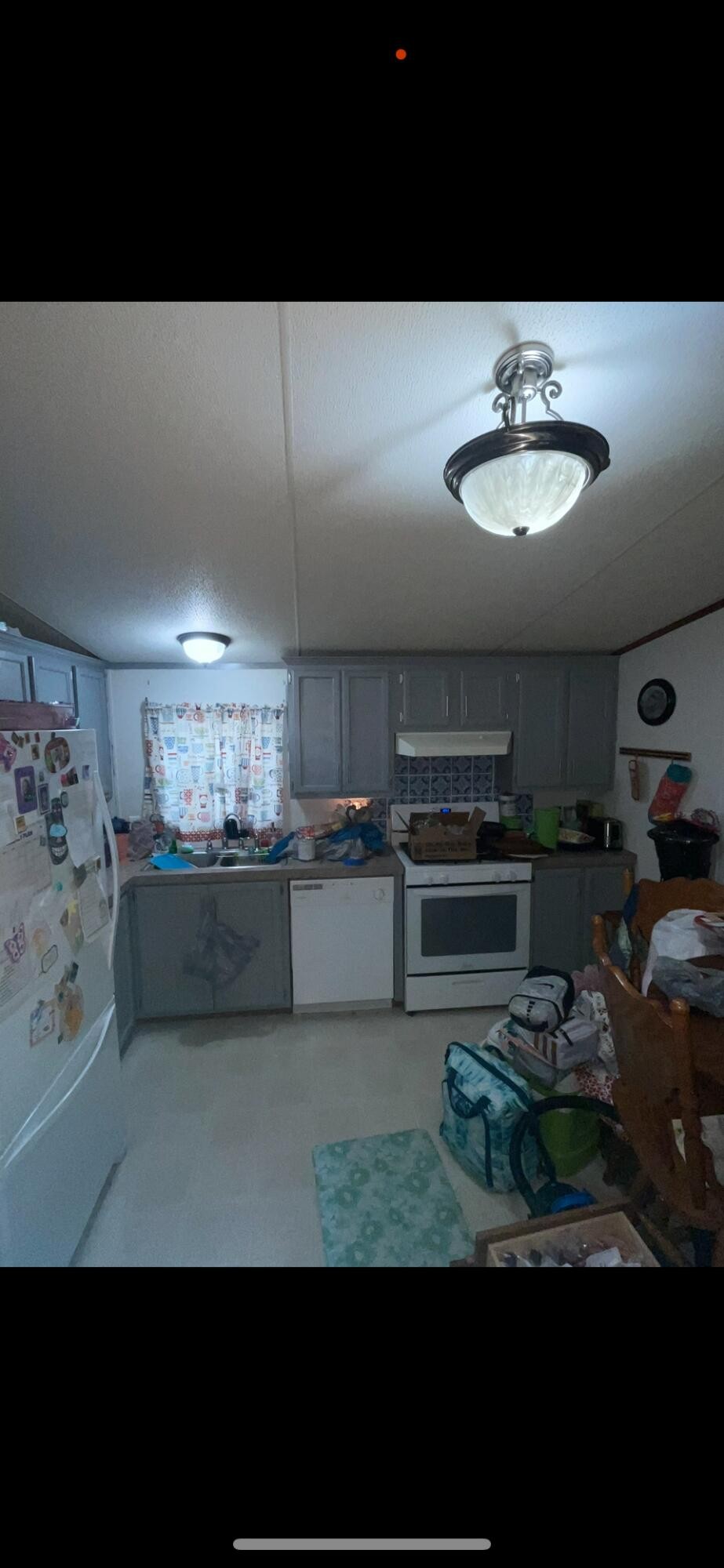 122 Haddock Lane Benton, TN 37307 - Photo 22 of 23 a kitchen with kitchen island granite countertop counter top space a sink and appliances