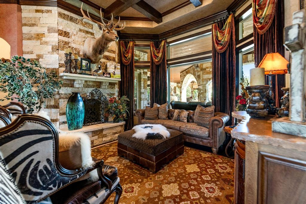 610 River Ranch Road Aledo, TX 76008 - Photo 18 of 40 Sitting room with beamed ceiling, coffered ceiling, and a stone fireplace