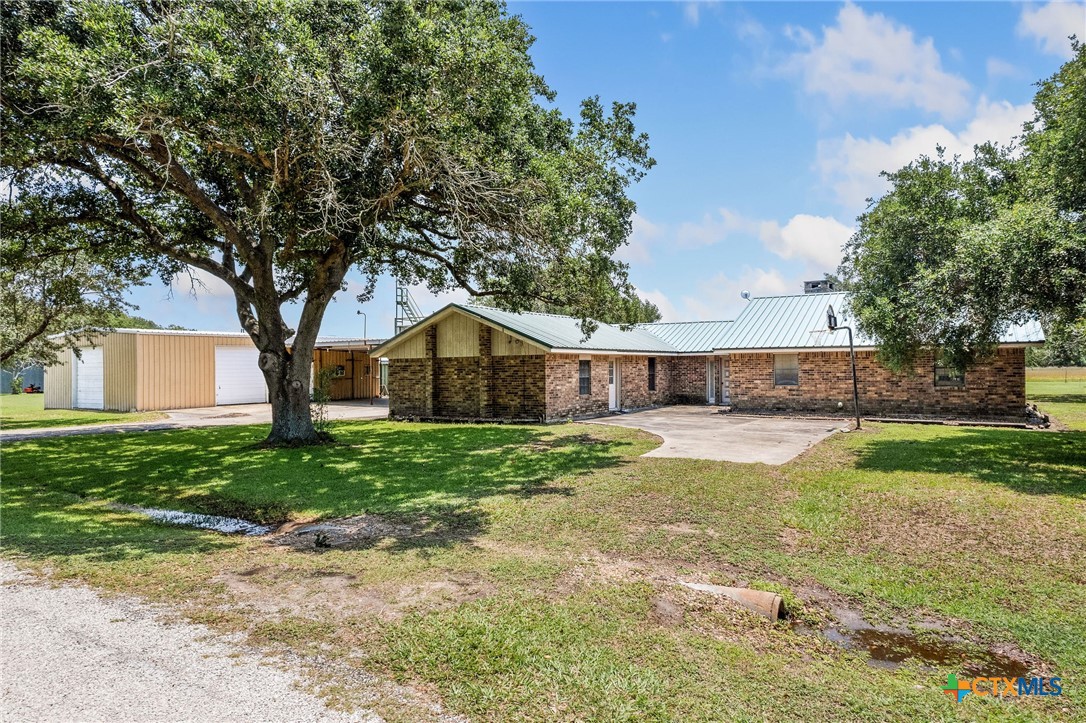 181 Pecan Street Port Lavaca, TX 77979 - Photo 1 of 34 a front view of a house with yard and green space