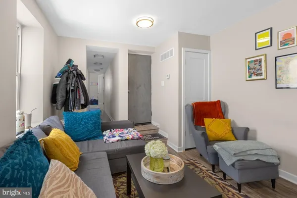 a living room with furniture and a rug