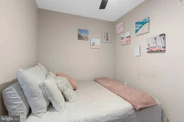 a bedroom with a bed and a couch