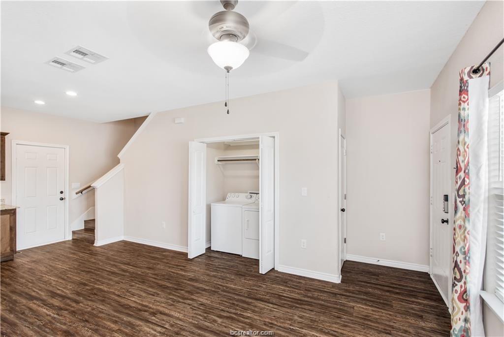2108 Cavitt Avenue, Unit A Bryan, TX 77801 - Photo 6 of 14 a view of a livingroom with wooden floor and staircase