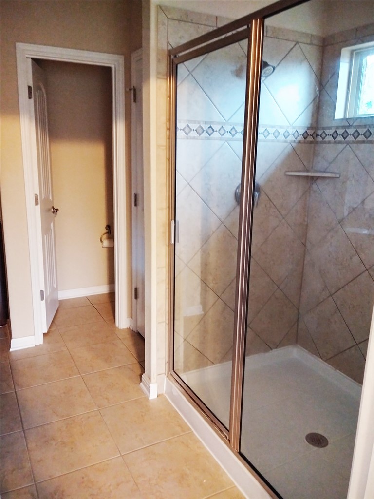 348 Stone View Trail Austin, TX 78737 - Photo 12 of 26 Walk in shower with high window in the master bathroom