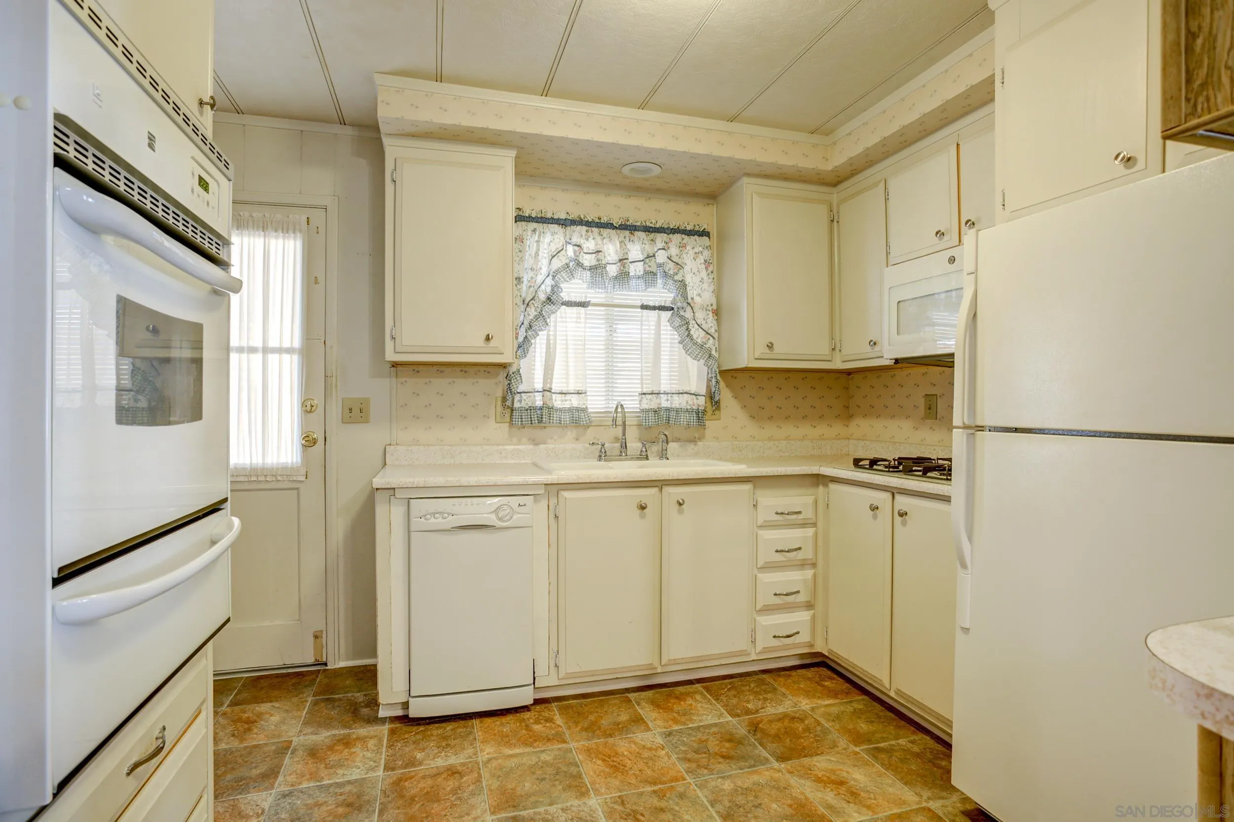 2400 Alpine Boulevard, Unit 84 Alpine, CA 91901 - Photo 11 of 16 a bathroom with a granite countertop sink and a mirror