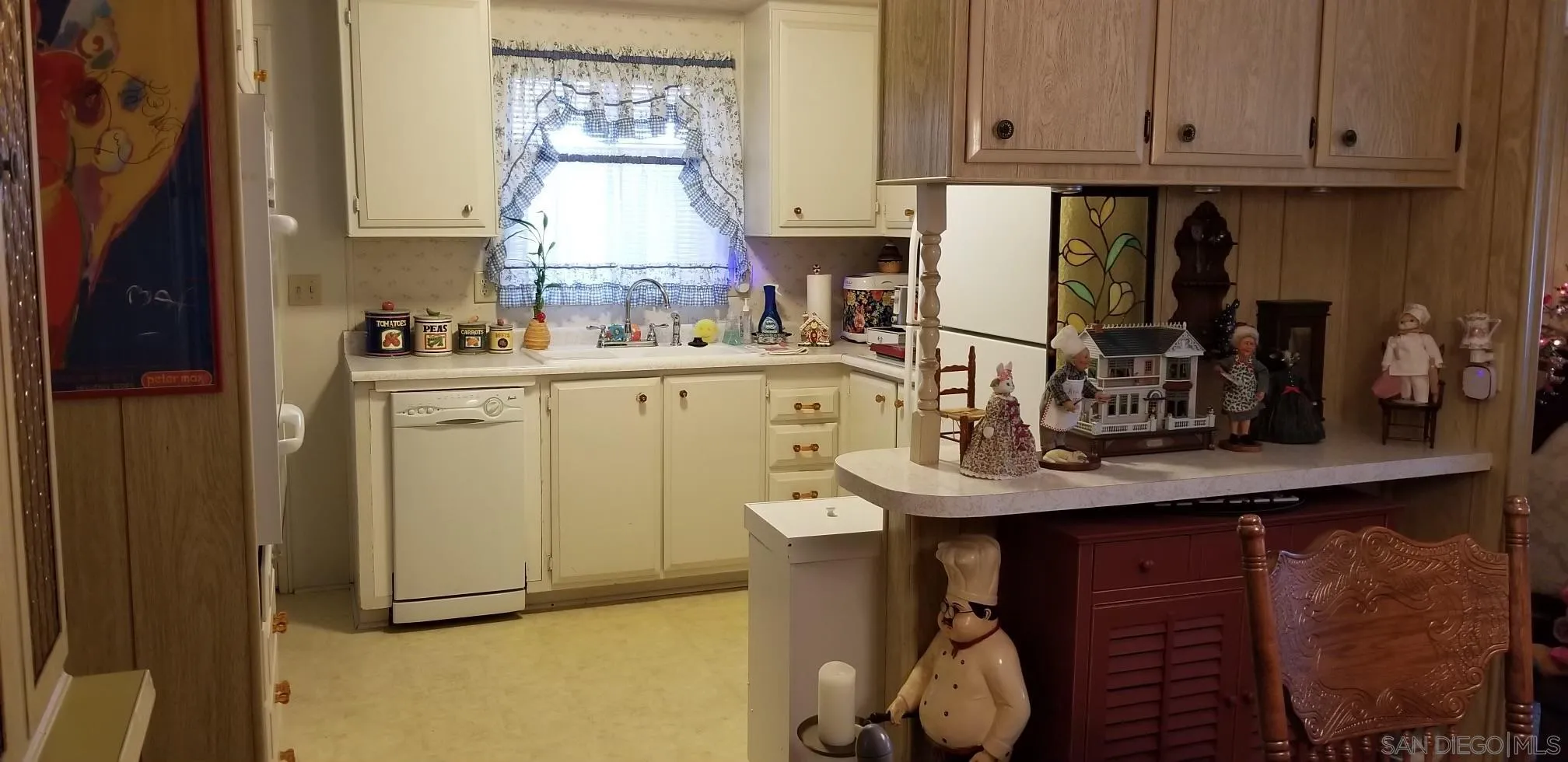 2400 Alpine Boulevard, Unit 84 Alpine, CA 91901 - Photo 15 of 16 a kitchen with a sink cabinets and wooden floor