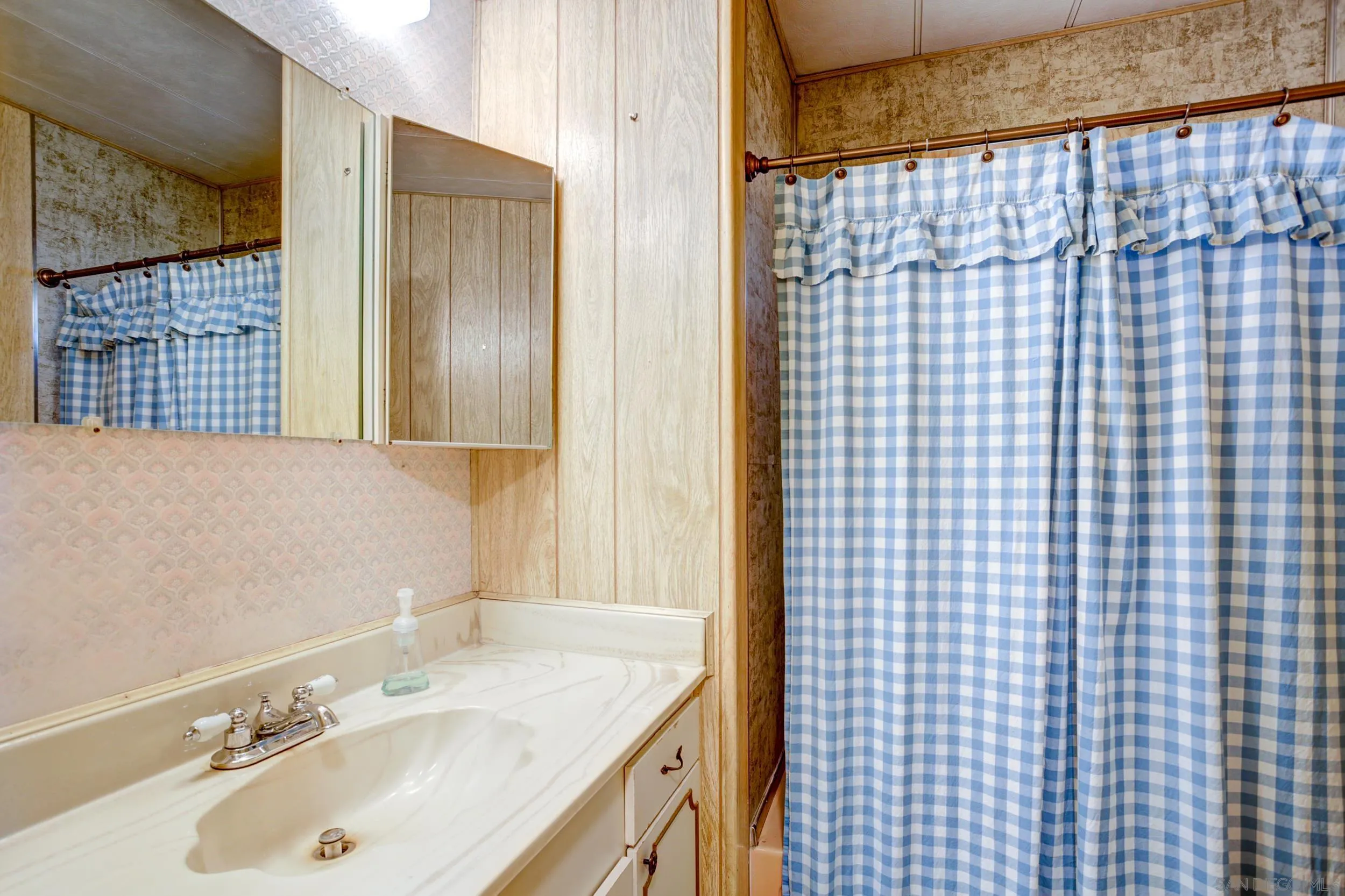 2400 Alpine Boulevard, Unit 84 Alpine, CA 91901 - Photo 4 of 16 a bathroom with a sink vanity granite and a shower