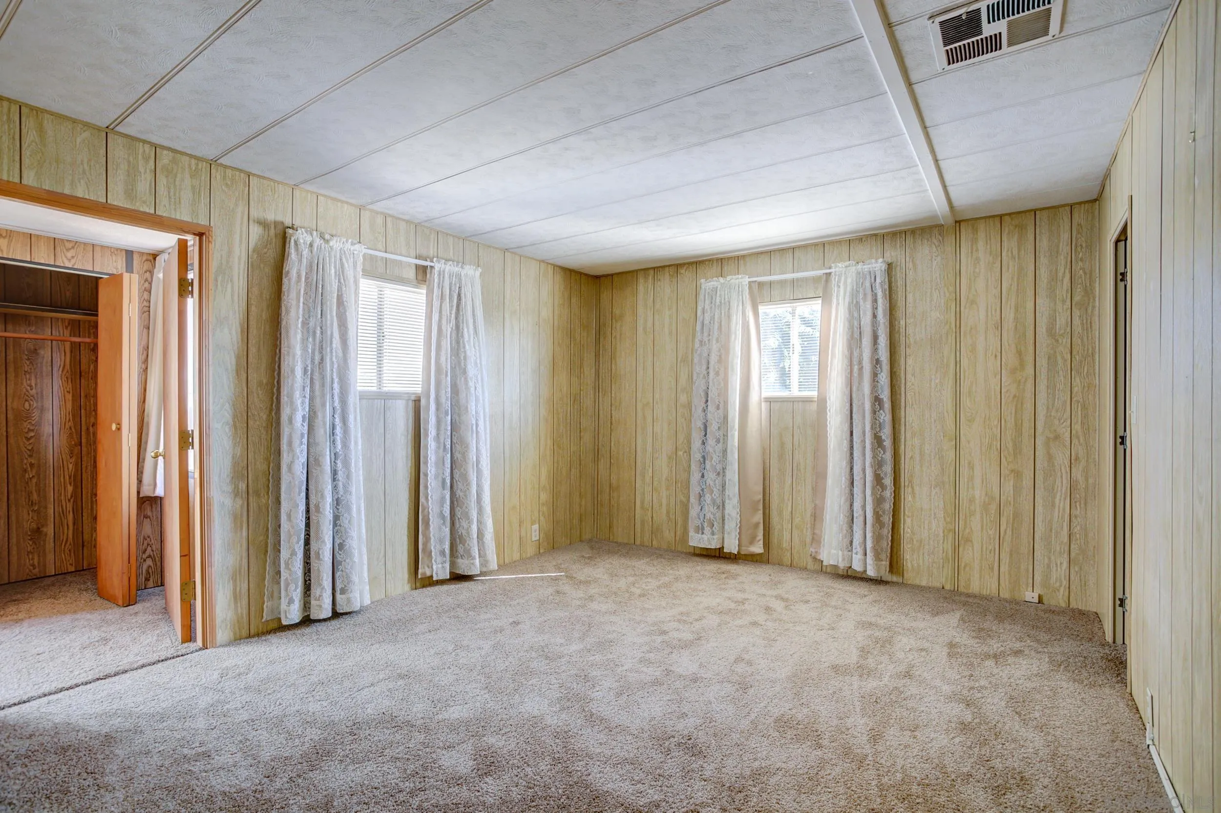 2400 Alpine Boulevard, Unit 84 Alpine, CA 91901 - Photo 5 of 16 an empty room with windows