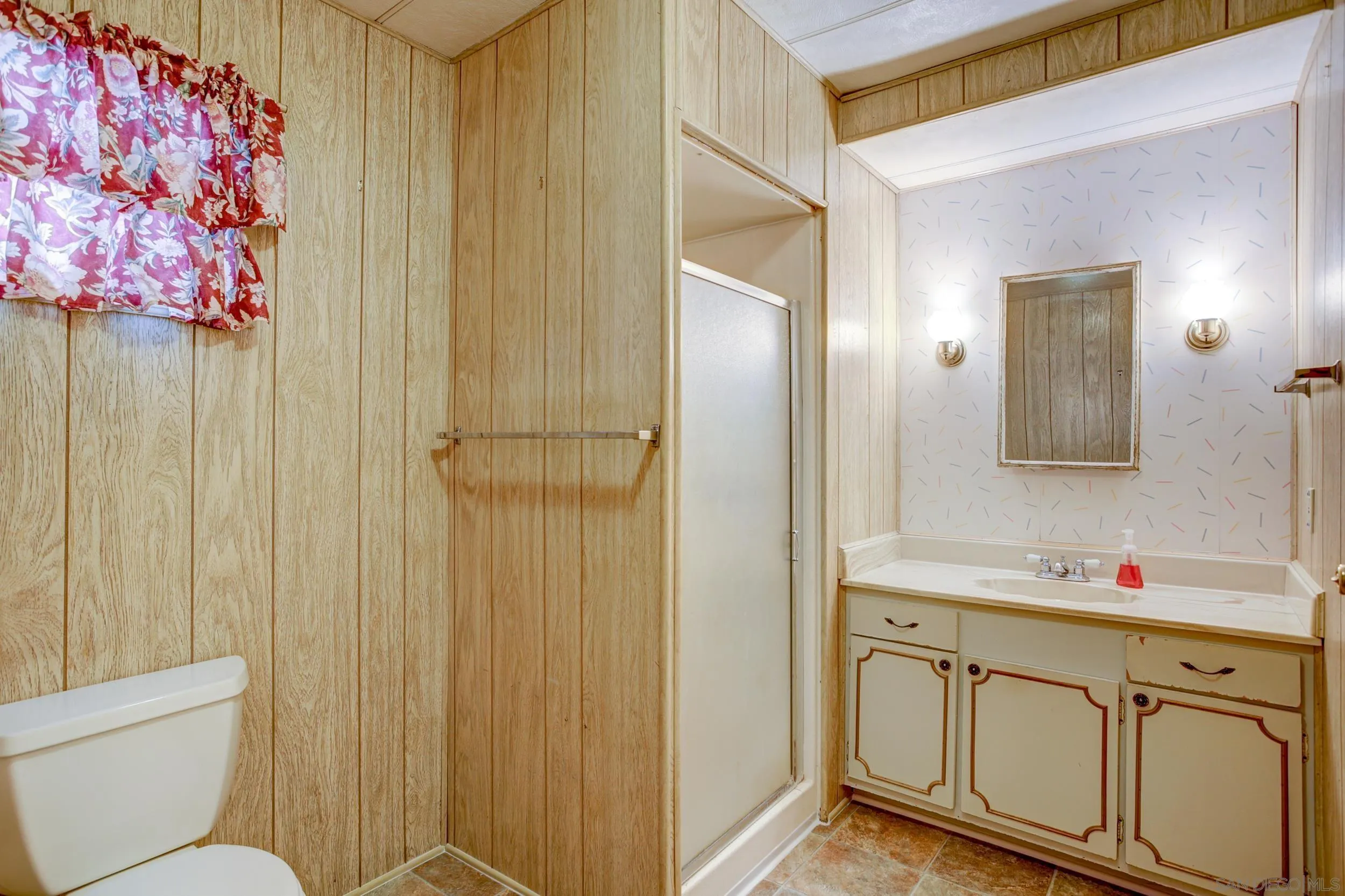 2400 Alpine Boulevard, Unit 84 Alpine, CA 91901 - Photo 6 of 16 a bathroom with a sink mirror vanity and toilet