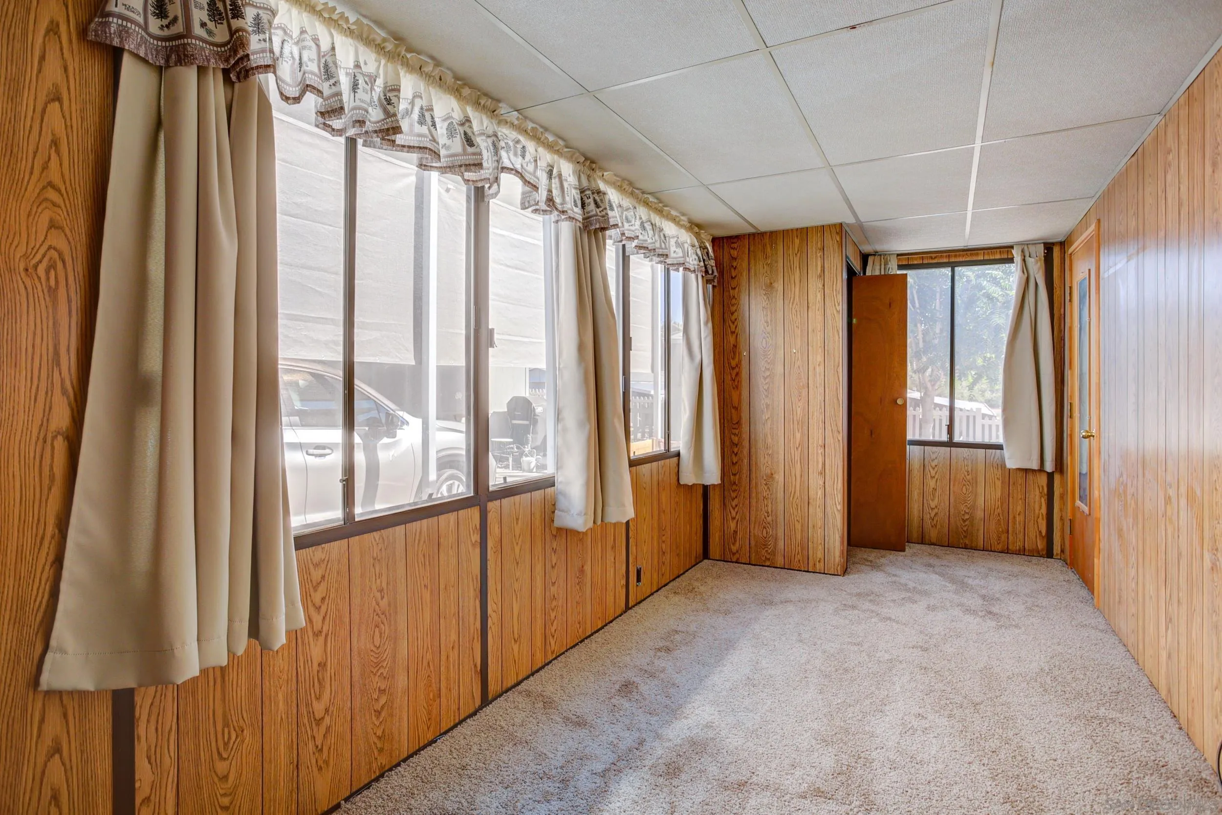 2400 Alpine Boulevard, Unit 84 Alpine, CA 91901 - Photo 7 of 16 a view of an empty room with a window