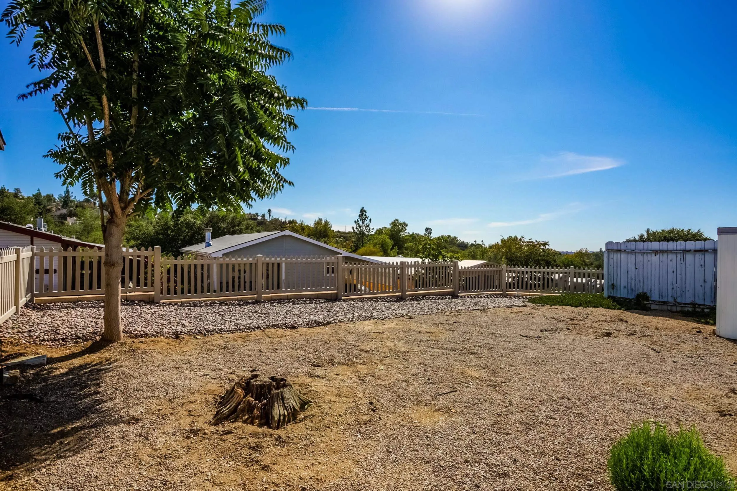 2400 Alpine Boulevard, Unit 84 Alpine, CA 91901 - Photo 9 of 16 a view of a house with a yard