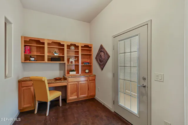 a view of a hallway with windows